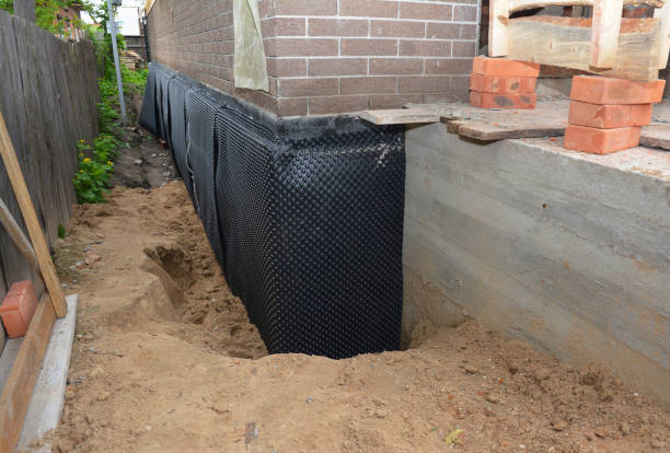 SJ Waterproofing Pros technician performing targeted Emergency Waterproofing assessment in Hanover, MD